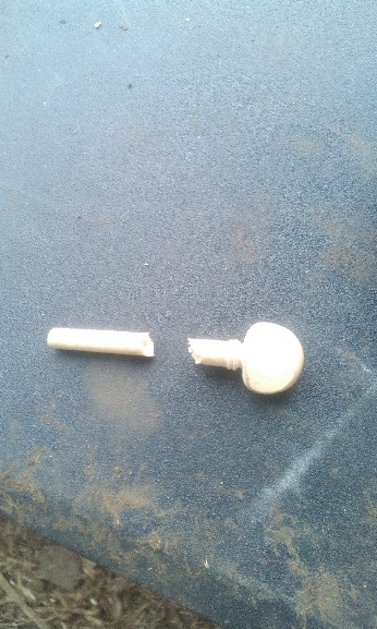 A sadly broken wooden tuning peg.